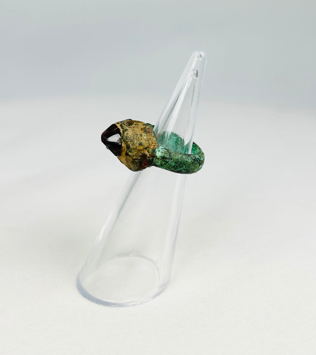Neo-Assyrian bronze ring featuring garnet intaglio and green patina