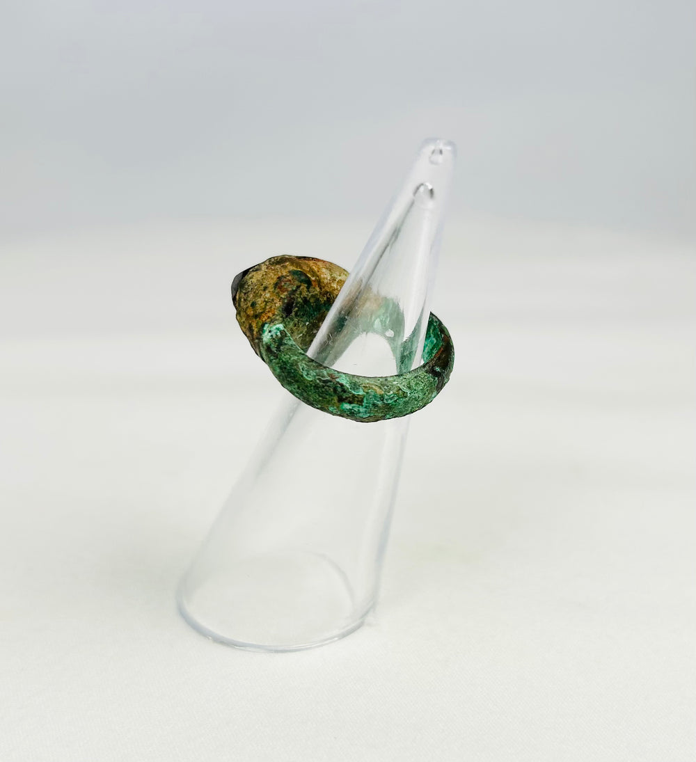 Ancient bronze ring with raised bezel and natural green patina