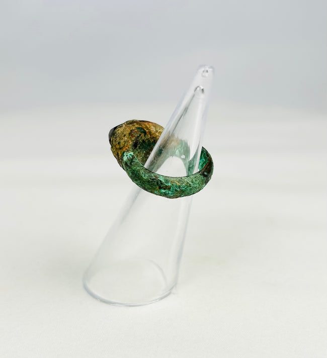 Ancient bronze ring with raised bezel and natural green patina