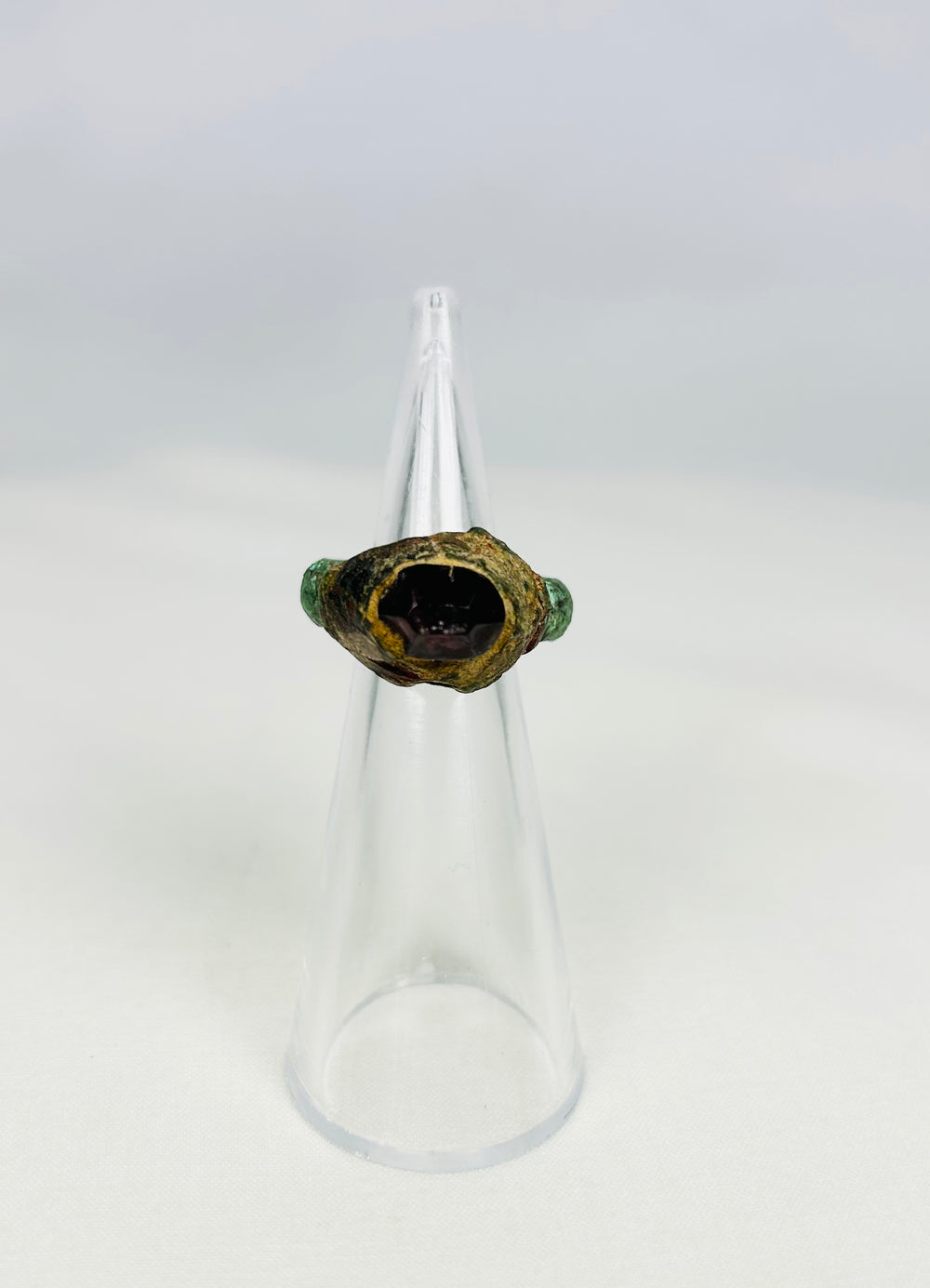 Ancient Assyrian bronze ring with garnet intaglio from 9th–7th century BCE