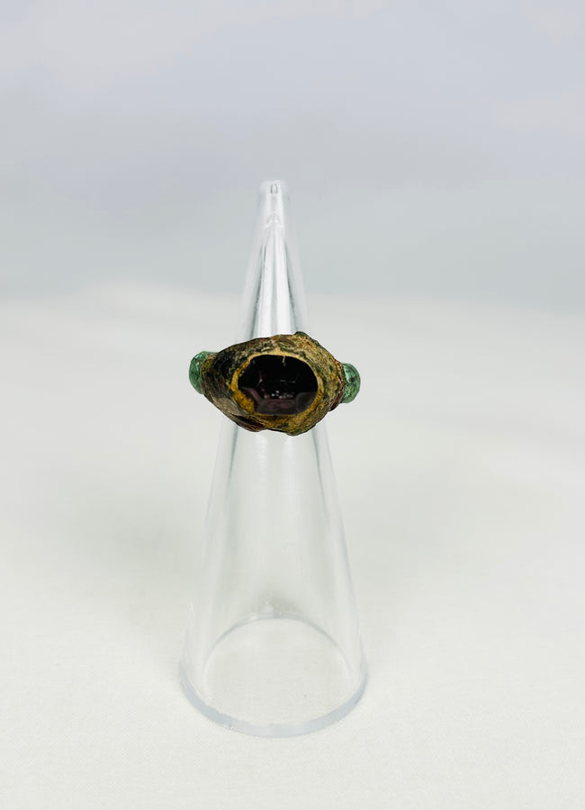 Ancient Assyrian bronze ring with garnet intaglio from 9th–7th century BCE