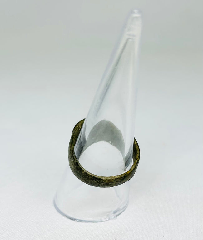 Top view of ancient Roman bronze ring, showing circular bezel and engraved Christogram, 1st–4th Century CE, early Christian artifact.