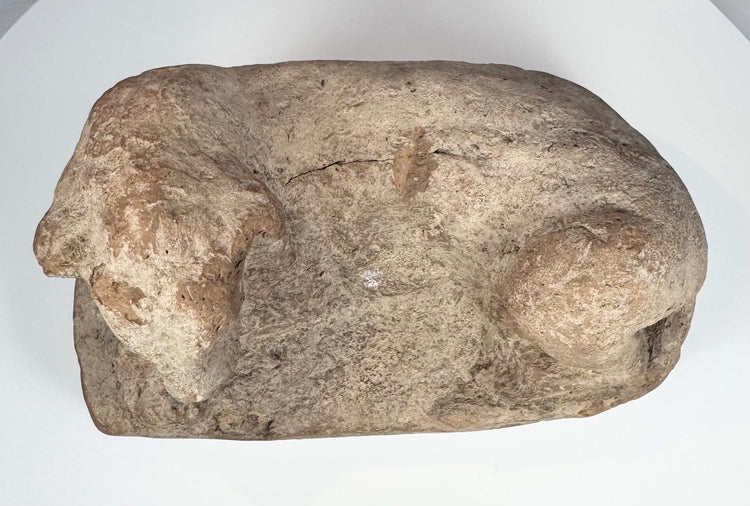 Ancient Egyptian terracotta lion artifact with almond-shaped eyes and pronounced muzzle