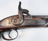 Indo-Afghan martial pistol with iron barrel, engraved lockwork, and brass reinforcement