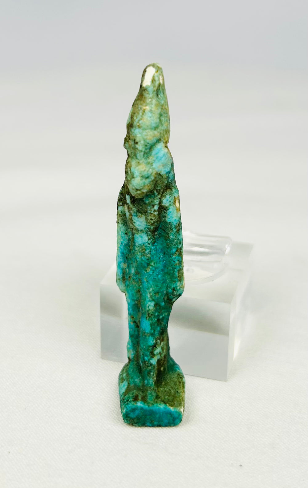 Ancient turquoise faience amulet of Sekhmet with detailed feline head and plain wig