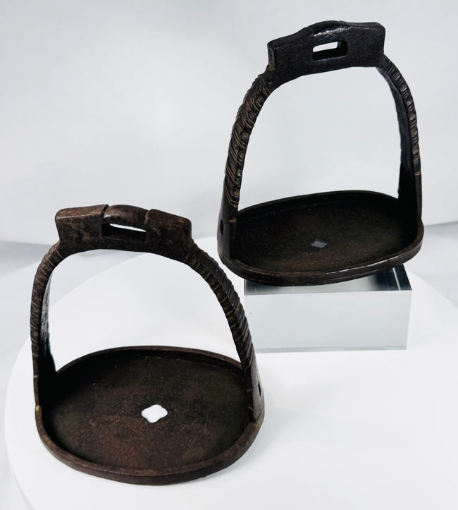 Antique Chinese equestrian stirrups with pierced tread plates and suspension loops