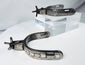 Antique Southwestern horse-riding spurs with engraved foliate silver panels