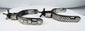 Early 20th-century American cowboy spurs with silver decoration and aged patina