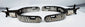 Silver-inlaid antique ranching spurs with geometric decoration and steel rowels