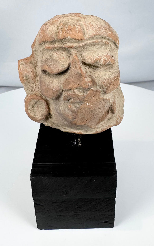 Weathered Pre-Columbian terracotta head fragment with burial accretions and surface patina
