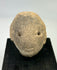 Terracotta head fragment from Nayarit or Jalisco, Pre-Columbian, with subtle mouth and drilled eyes, mounted for display, 300 BCE–300 CE