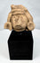 Pre-Columbian anthropomorphic stone fragment mounted on a custom display stand