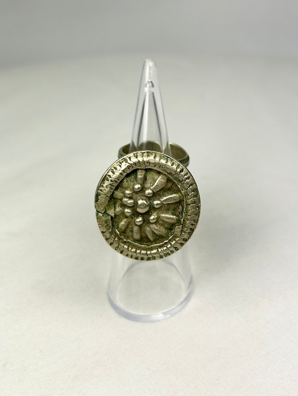 Antique Victorian silver ring featuring a beaded border surrounding a central rosette.