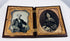 Antique Victorian ambrotype portrait pair with gilt brass mats and velvet lining