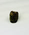 Archaeological Egyptian amulet bead carved with serpentine motifs and perforated for wearing