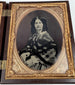 Victorian photographic case containing portraits of a formally dressed man and woman