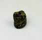 Small carved stone amulet from Egypt featuring symbolic snake forms and worn surface