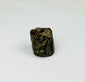 Early Egyptian talisman bead with incised serpentine patterns and central stringing hole