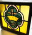 Historic 16x16 in. stained glass panel, early 1900s, cross and crown motif in colored glass set in wooden frame.