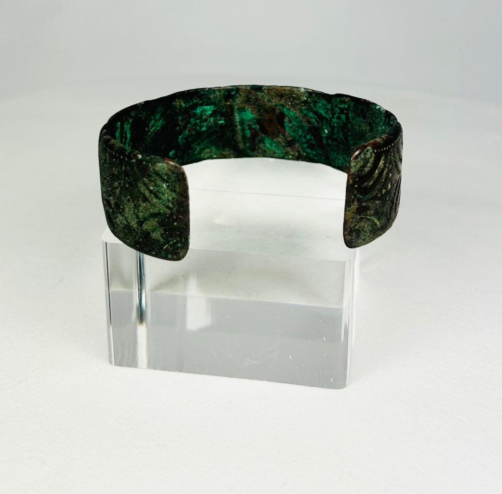 Ancient Persian bronze bracelet with open cuff form and aged surface patina