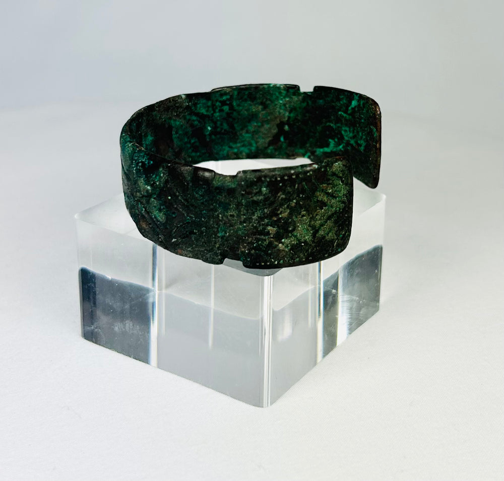 Close-up of Sassanian bronze cuff bracelet highlighting corrosion and texture