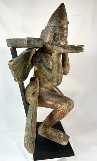 Antique Hindu Garuda statue — right-side profile on black pedestal.
