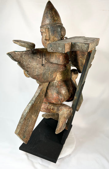 Bronze Garuda deity — angled rear perspective revealing sculptural depth