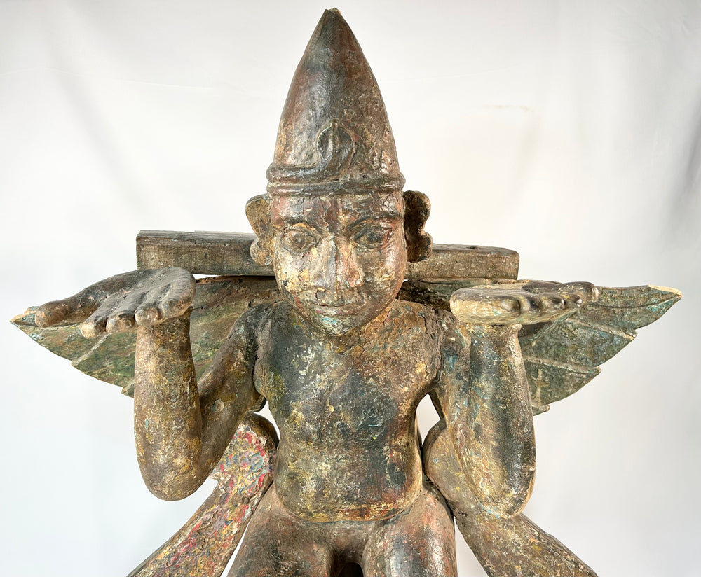 Sacred Garuda statue — detailed view of wings, ornaments, and pedestal base