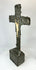 Antique crucifix — three-quarter front view showing gilded highlights and dark patina.