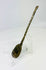 Low left angle of Roman or Byzantine bronze spoon emphasizing bowl curvature, handle twist, and aged bronze sheen.