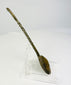 Right side profile of ancient bronze spoon displaying corrosion and natural verdigris from age.