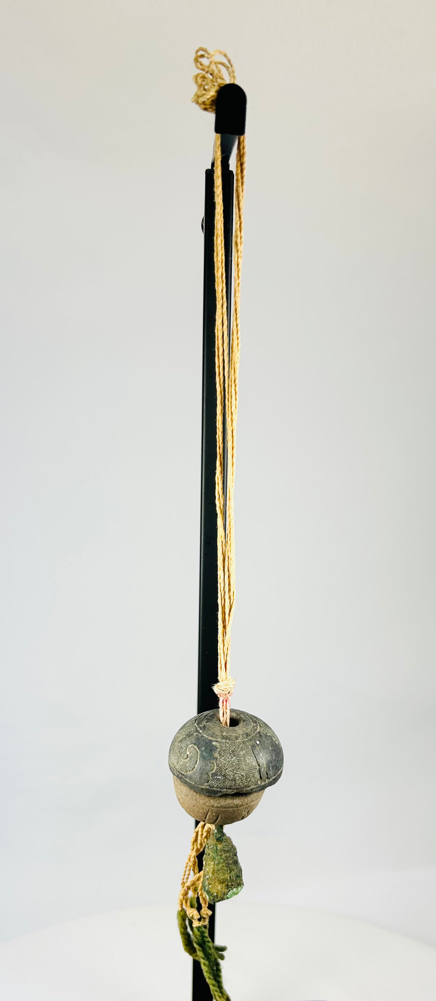 Detailed upper section showing twisted cord attachment and aged fiber condition