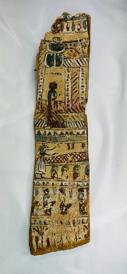 Full frontal view of ancient Egyptian coffin panel showing multiple registers of figures and symbols painted in red, blue, and green