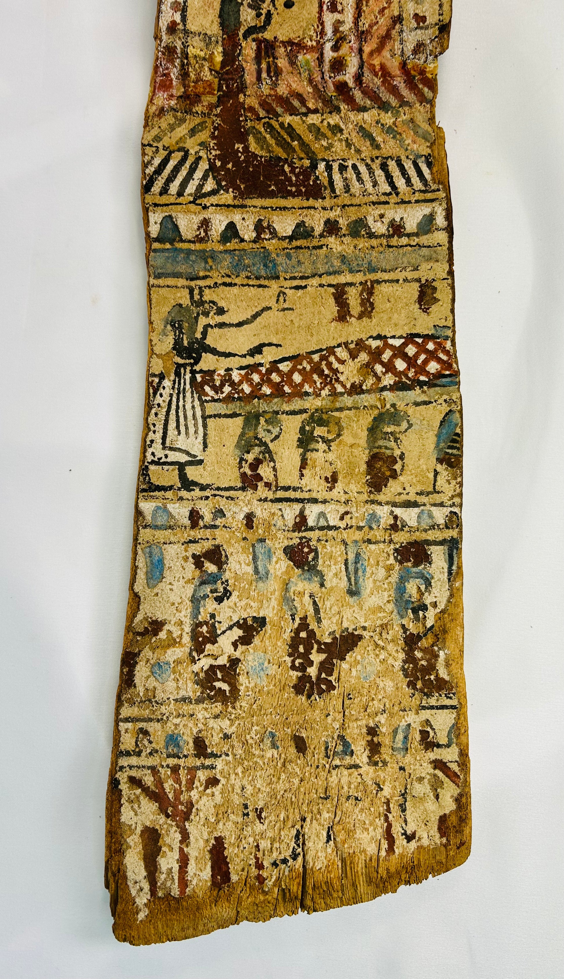 Lower portion of Egyptian coffin fragment showing procession of deities and offering bearers in painted register