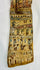 Lower portion of Egyptian coffin fragment showing procession of deities and offering bearers in painted register