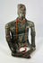 Frontal view of seated Nayarit terracotta effigy with red bead necklaces and elaborate arm bands.
