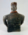 Rear view of Pre-Columbian terracotta figure showing headdress and smooth aged surface texture.