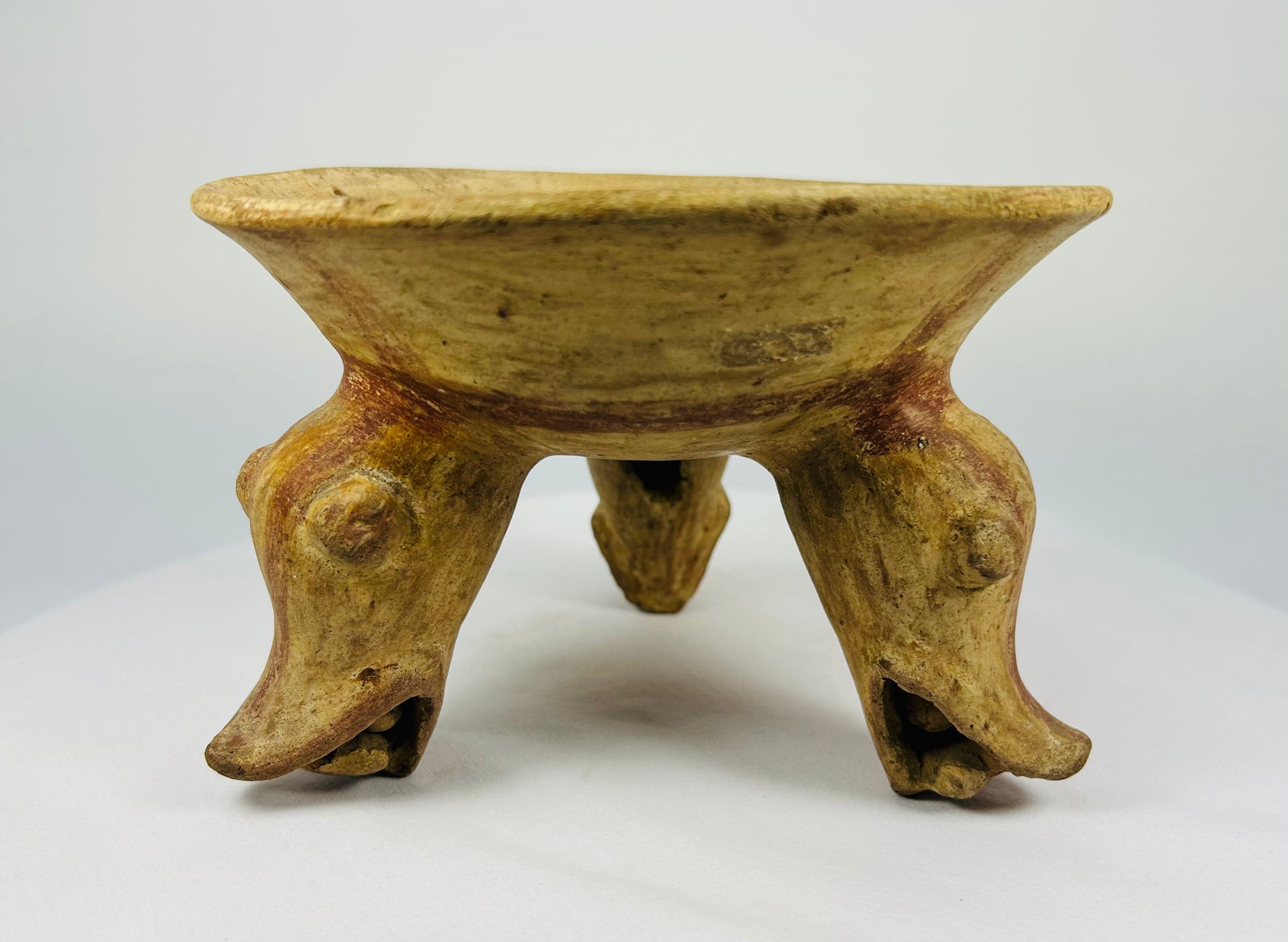 Ancient ceramic bowl with three animal-form legs and red-brown slip, Costa Rica, 800–1200 AD