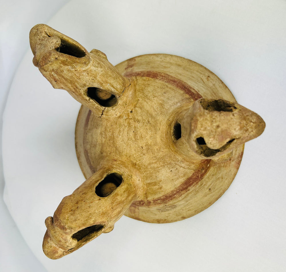 Underside view of tripod bowl showing three hollow animal-head supports, Costa Rican origin