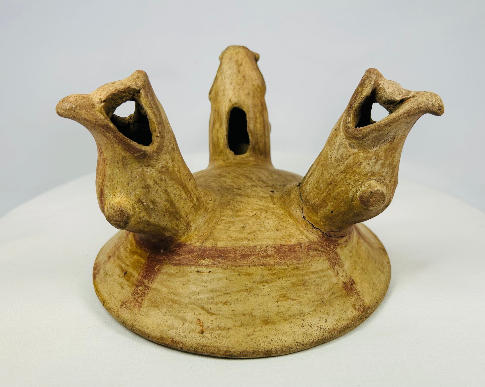 Front view of Pre-Columbian tripod bowl with open-mouthed animal legs, Guanacaste-Nicoya styl