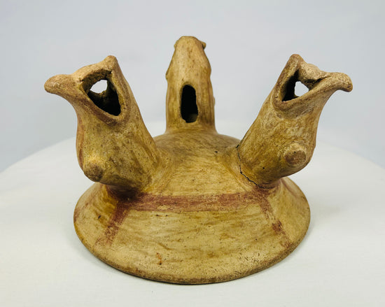Front view of Pre-Columbian tripod bowl with open-mouthed animal legs, Guanacaste-Nicoya styl