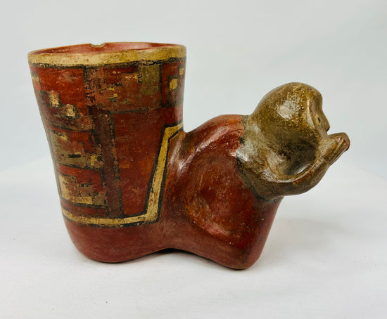 Effigy drinking vessel depicting a stylized human head and tall cylindrical body, Costa Rica, 800–1200 CE
