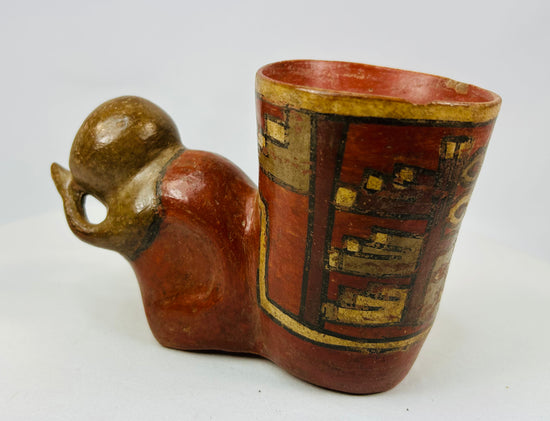 Ancient Nicoya effigy vessel with anthropomorphic head and geometric band in yellow, red, and black