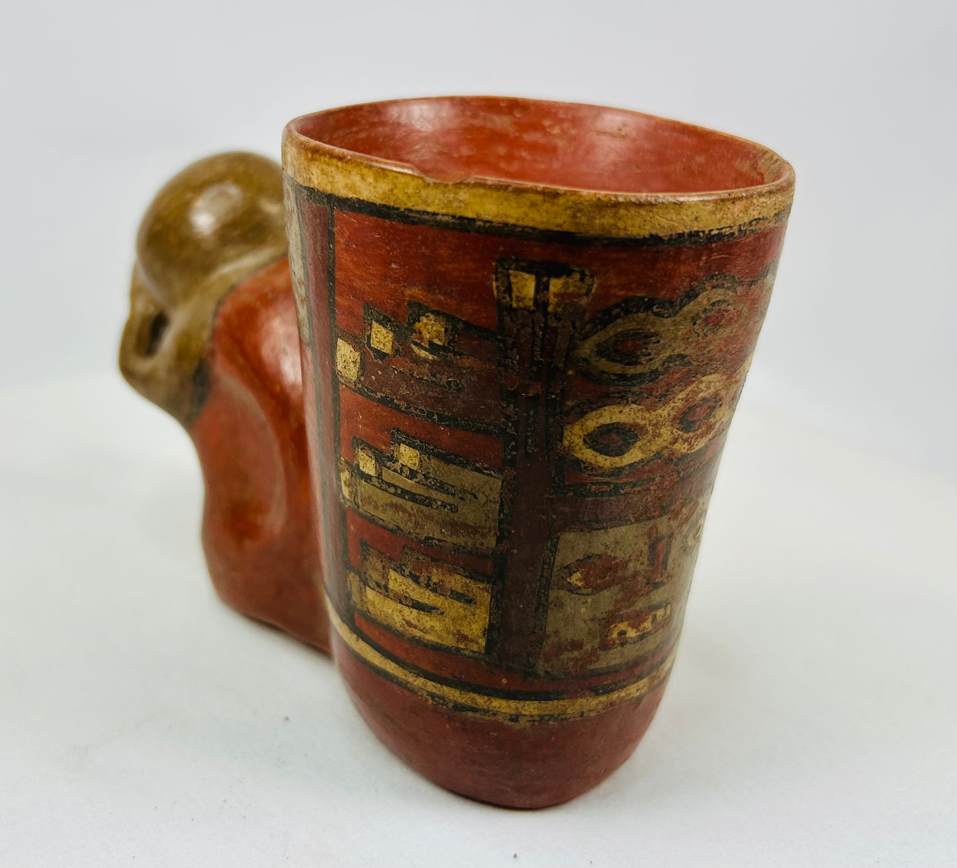 Polychrome effigy cup with painted geometric designs and modeled head element, Guanacaste-Nicoya culture