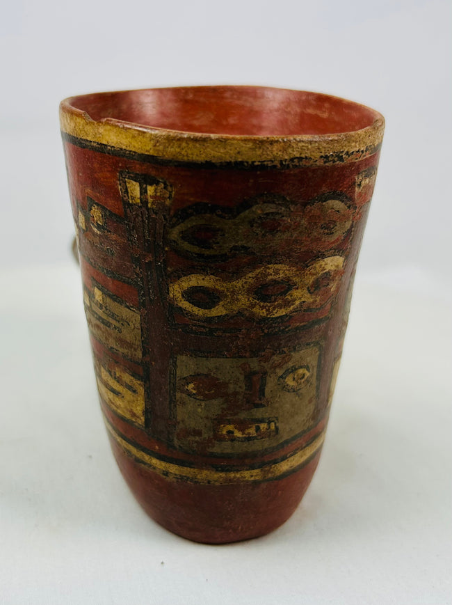 Tall Nicoya effigy vessel with red and ochre painted banding and stylized anthropomorphic head spout