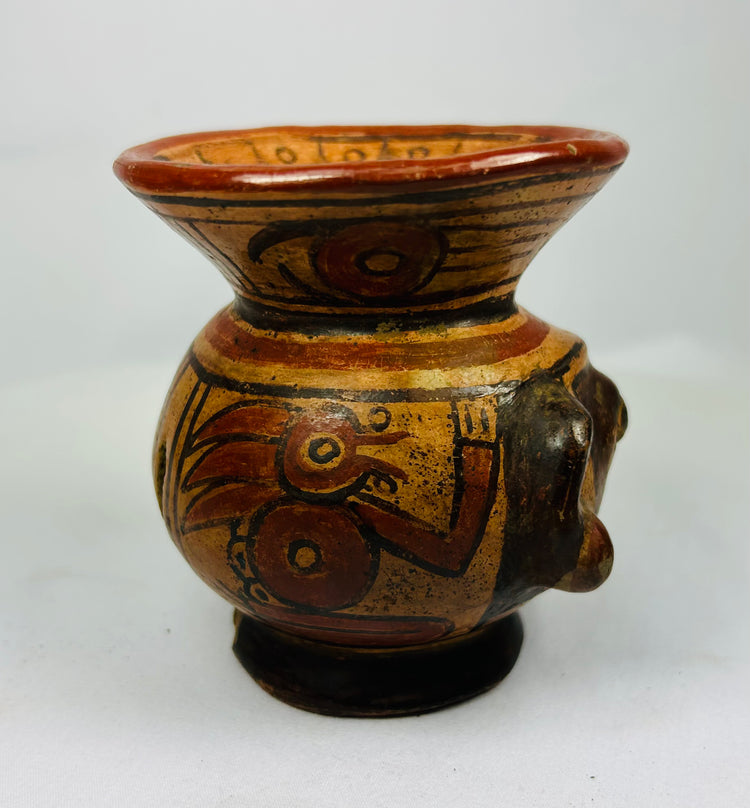 Right side of ancient Nicoya effigy vessel with expressive face and red-black geometric motifs