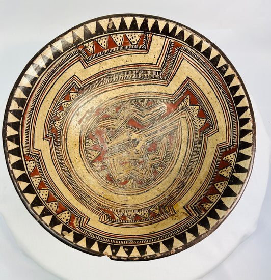 Macro image capturing pigment layering and surface texture on ancient Costa Rican ceremonial bowl.