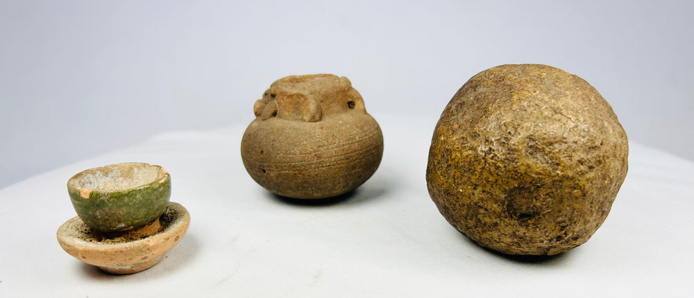 Small ancient ceramic jar with raised ornament and surface wear, 500–1500 CE, South Asian terracotta vessel.