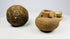 Three-piece antiquities grouping: spherical stone tool, miniature terracotta jar, and green-glazed ceremonial cup.