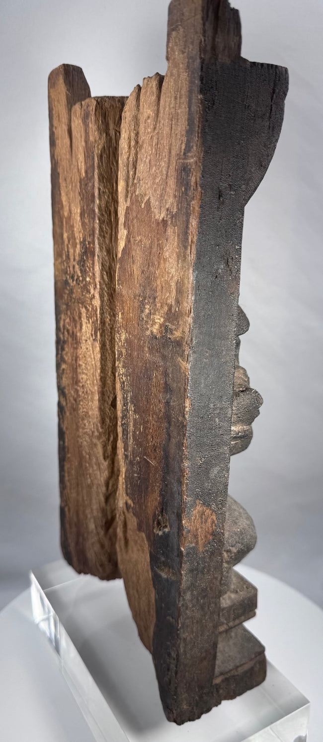 Weathered Hindu wood carving of Gajalakshmi beneath an elaborate headdress